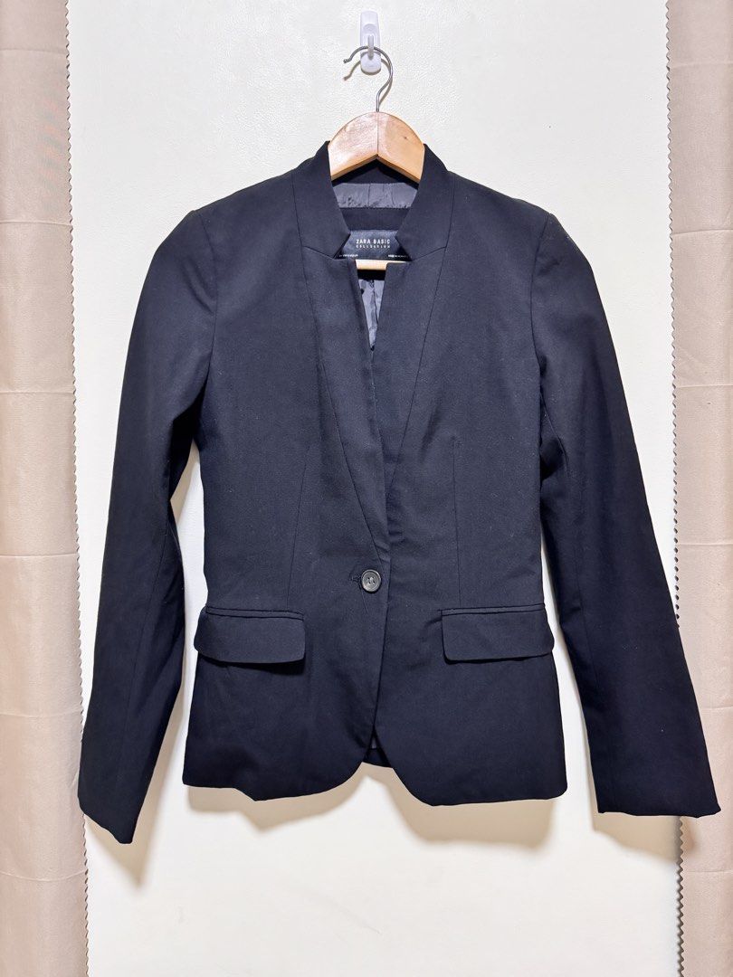 Zara Black Blazer (Category: Coats, Jackets and Outerwear) located in Manila. Submitted by seayouncey (Listing ID 1469881610, Image 1). Description: Size: length 24 inches, shoulder back 14 inchs - Brand: Zara Basic Collection - Color: Classic Black - Size: EUR 34 / USA 2 / MEX 24 - Design: Single-button front closure with structured lapel - Features: Two front flap pockets, fully lined interior - Origin: Made in Morocco - Condition: Clean, minim