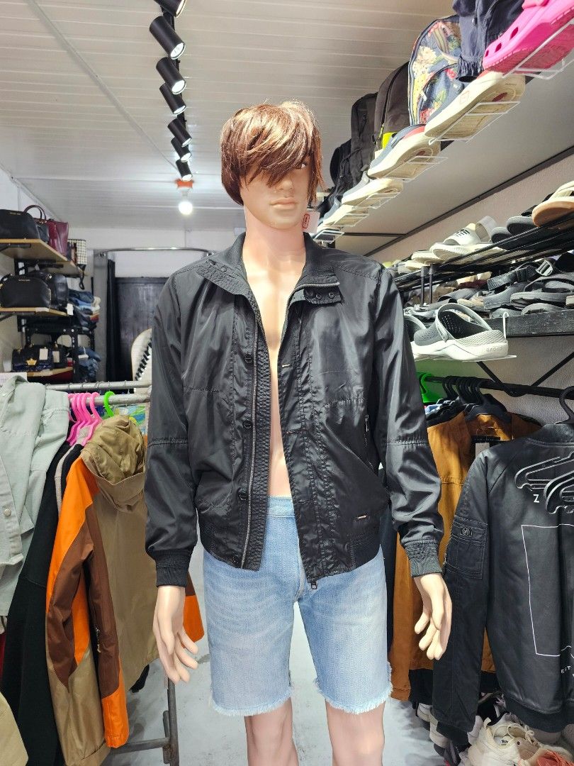 Zara black nylon bomber jacket (Category: Coats, Jackets and Outerwear) located in Baguio. Submitted by kayeonlineshop (Listing ID 1469856404, Image 2). Description: features a distinctive high double-snap collar, unique paneling across the chest with concealed utility pockets, and mid-sleeve structural horizontal stitching..