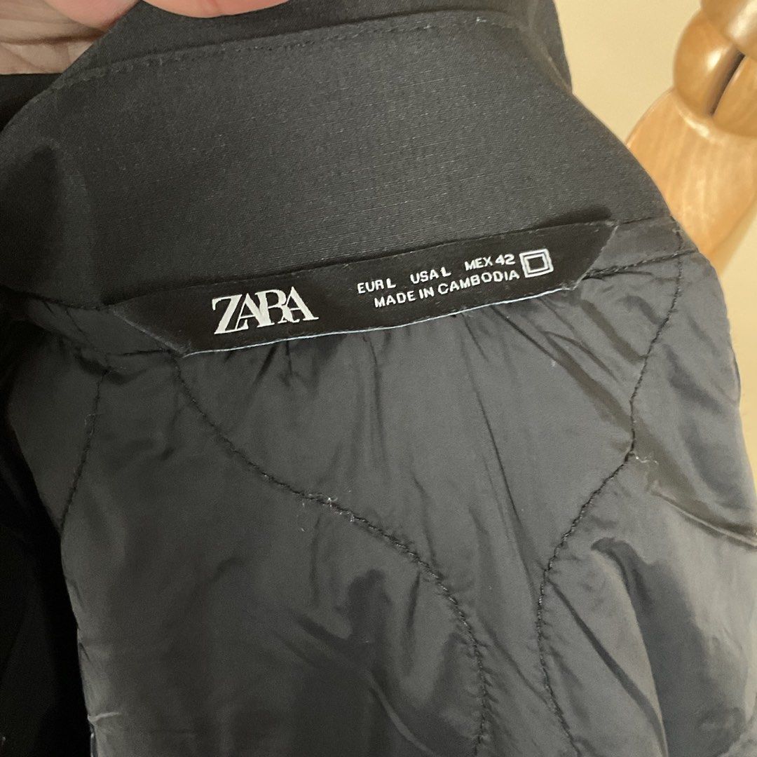 Zara Black Quilted Lined Jacket (Category: Coats, Jackets and Outerwear) located in La Trinidad. Submitted by di_tiyak (Listing ID 1469778369, Image 3). Description: - Brand: Zara - Size: L - Color: Classic Black - Features: Full zip front, stylish collar, and large functional front pockets - Lining: Quilted interior for extra warmth - Fit & Style: Good weight for cooler weather, easy to layer over hoodies or tees - Origin: Made in Cambodia - Con