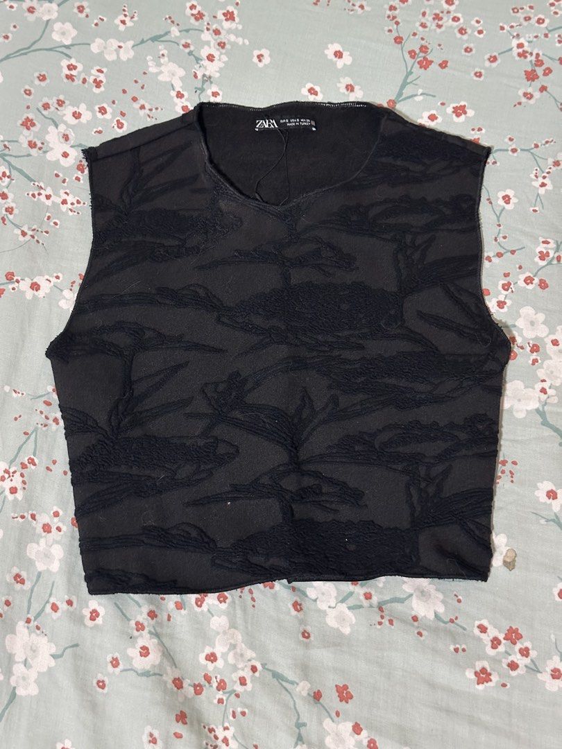 Zara Black Textured Sleeveless Crop Top (Category: Sleeveless) located in Mandaluyong City. Submitted by gelatinxx (Listing ID 1469911491, Image 1). Description: - Brand: Zara - Size: S (tag on collar) but can fit XS frames - Color: Black - Fit: Cropped sleeveless top - Details: Textured pattern throughout, crew neckline, raw hem finish, and backless detail - Material: Lightweight fabric, made in Turkey - Styling: Easy to pair with high-waisted j