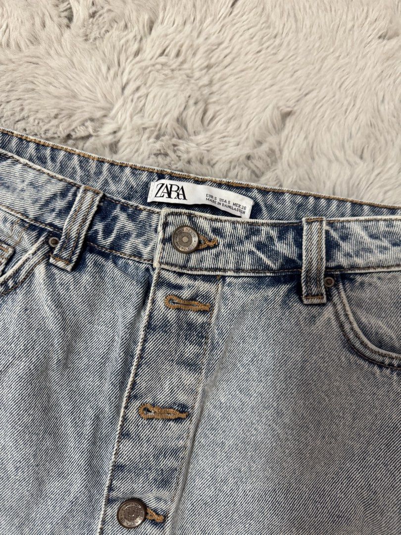 Zara Buttoned Denim Mini Skirt Light Blue (Category: Skirts) located in Calamba. Submitted by cheriiv (Listing ID 1469838163, Image 3). Description: Washed, never worn - Brand: Zara - Size: Small (S) - Color: Light blue denim - Style: Button-front mini skirt with metal hardware and front pockets - Detail: Trendy raw frayed hemline - Condition: Great everyday wardrobe staple, easy to style with tees or sweaters.