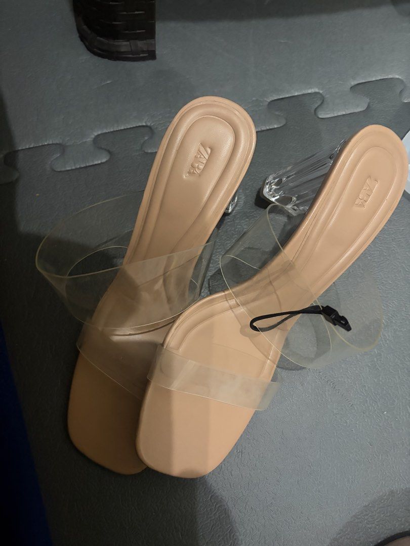 Zara Clear Strap Block Heels Size 40 Nude (Category: Heels) located in Manila. Submitted by viadinamama143 (Listing ID 1469811766, Image 2). Description: - Brand: Zara - Style: Nude block heels with clear transparent straps and square toe - Size: EUR 40 - Condition: Brand new, never worn, with tag attached - Versatile neutral shade that goes with any outfit.