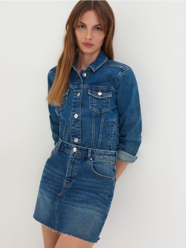 Zara Denim Dress Size S (Category: Dresses) located in Taguig. Submitted by thrifthub.ph (Listing ID 1469788705, Image 1). Description: - Brand: Zara - Size: S - Material/Origin: Made in Turkey - Design: Blue denim mini dress combining a jean jacket top with a skirt bottom - Details: Button-up front with metal buttons, chest pockets, and functional side pockets - Hem: Trendy raw frayed hem - Condition: Excellent.