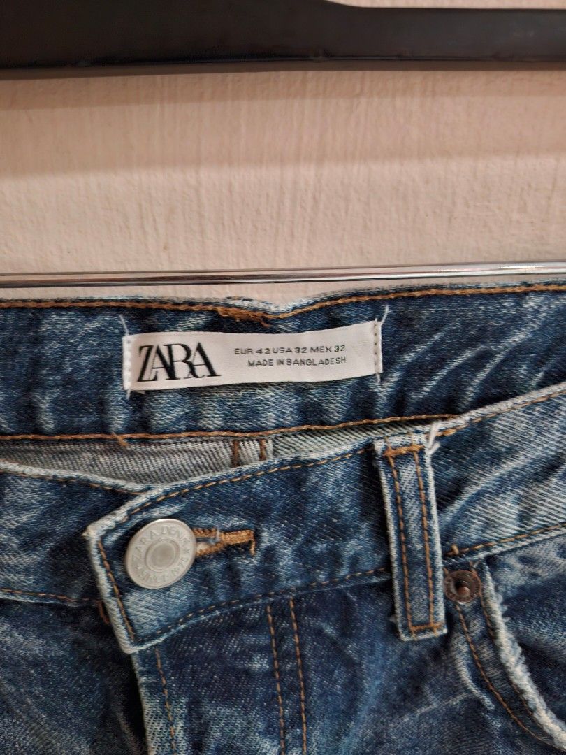 ZARA Distressed Denim Jeans Size 32 (Category: Jeans) located in Quezon City. Submitted by phillip31 (Listing ID 1469785865, Image 2). Description: - Brand: ZARA - Size: EUR 42, USA 32, MEX 32 - Style: Distressed, washed finish with ripped knee detail - Pockets: Frayed edge front pockets and classic back patch pockets - Closure: Button fly with classic tan stitching - Origin: Made in Bangladesh - Condition: Great quality, ready to wear.