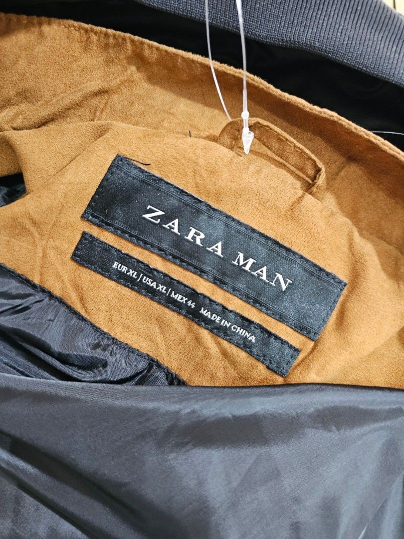 Zara Man Faux Suede Zip-Up Jacket (Category: Coats, Jackets and Outerwear) located in Baguio. Submitted by kayeonlineshop (Listing ID 1469855667, Image 3). Description: features a classic tan or camel faux-suede fabric with a distinctive horizontal stitch line across the chest, a small stand-up/mock collar, side welt pockets, and a full central zipper..