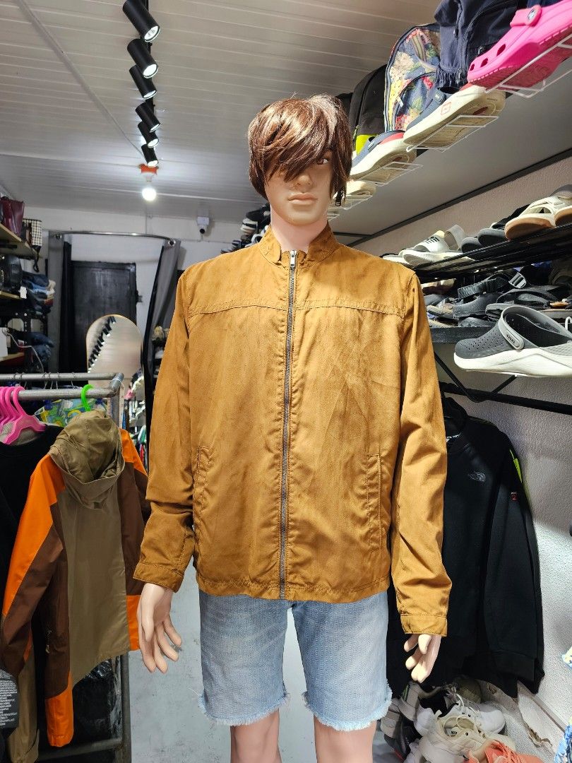 Zara Man Faux Suede Zip-Up Jacket (Category: Coats, Jackets and Outerwear) located in Baguio. Submitted by kayeonlineshop (Listing ID 1469855667, Image 1). Description: features a classic tan or camel faux-suede fabric with a distinctive horizontal stitch line across the chest, a small stand-up/mock collar, side welt pockets, and a full central zipper..