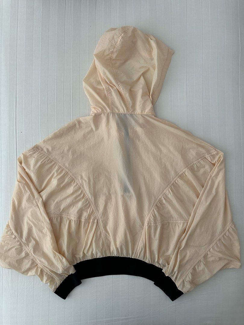 Zara Peach Cropped Windbreaker Jacket Size M (Category: Coats, Jackets and Outerwear) located in Manila. Submitted by denise805 (Listing ID 1469886479, Image 2). Description: - Brand: Zara - Style: Cropped windbreaker - Size: M - Color: Peach with contrasting black details - Features: Half-zip closure with ring pull, hooded neckline, grommet details, gathered seam accents - Cuffs & Hem: Black ribbed for a snug fit - Material: Lightweight, easy to