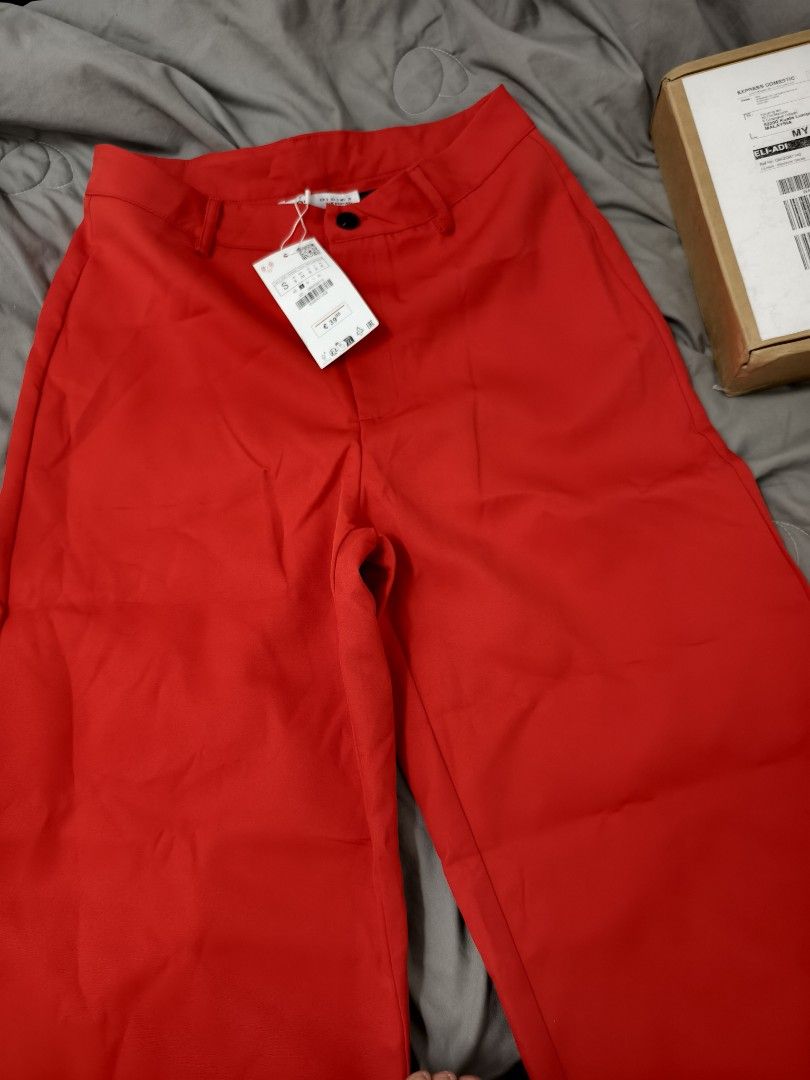 Zara Red Pants Size S (Category: Jeans) located in Angeles City. Submitted by measaliman02351 (Listing ID 1469862035, Image 1). Description: - Brand: Zara - Size: S - Condition: Brand new with tags (BNWT) - Color: Bright red (statement piece) - Origin: Made in Portugal - Details: Standard button closure with belt loops.