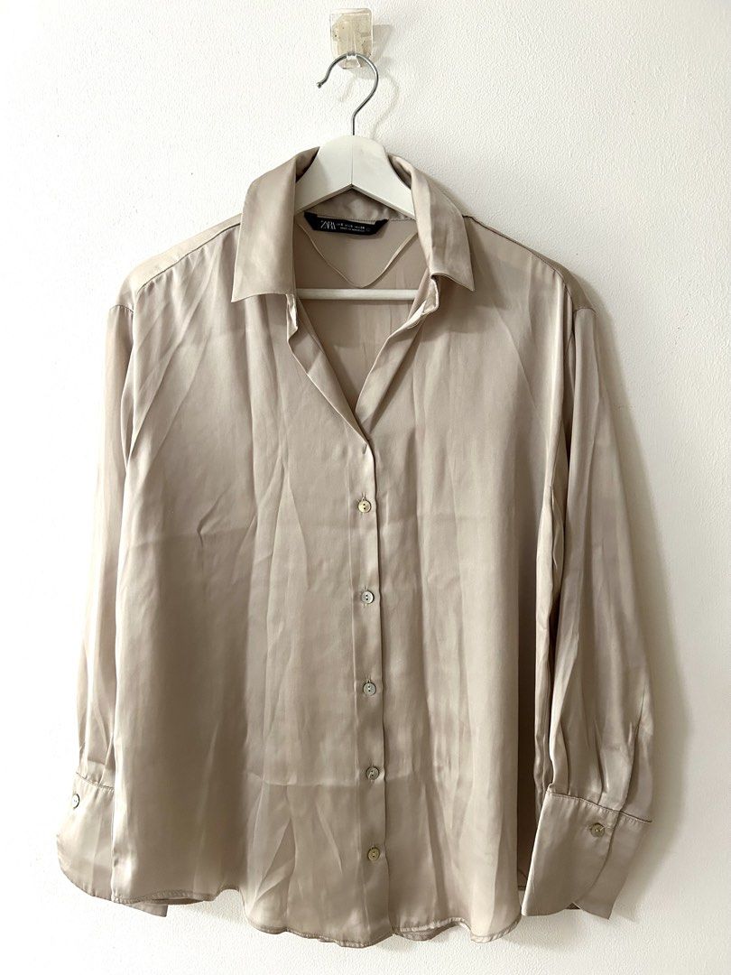 Zara Satin Button-Down Blouse Champagne Size S (Category: Blouses) located in Manila. Submitted by isabelle_1104 (Listing ID 1469943511, Image 1). Description: Condition 8/10. With pinholes in the chest area.