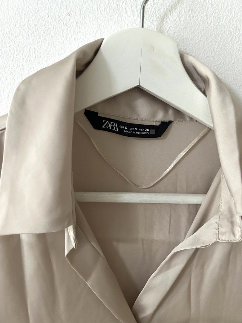 Zara Satin Button-Down Blouse Champagne Size S (Category: Blouses) located in Manila. Submitted by isabelle_1104 (Listing ID 1469943511, Image 2). Description: Condition 8/10. With pinholes in the chest area.