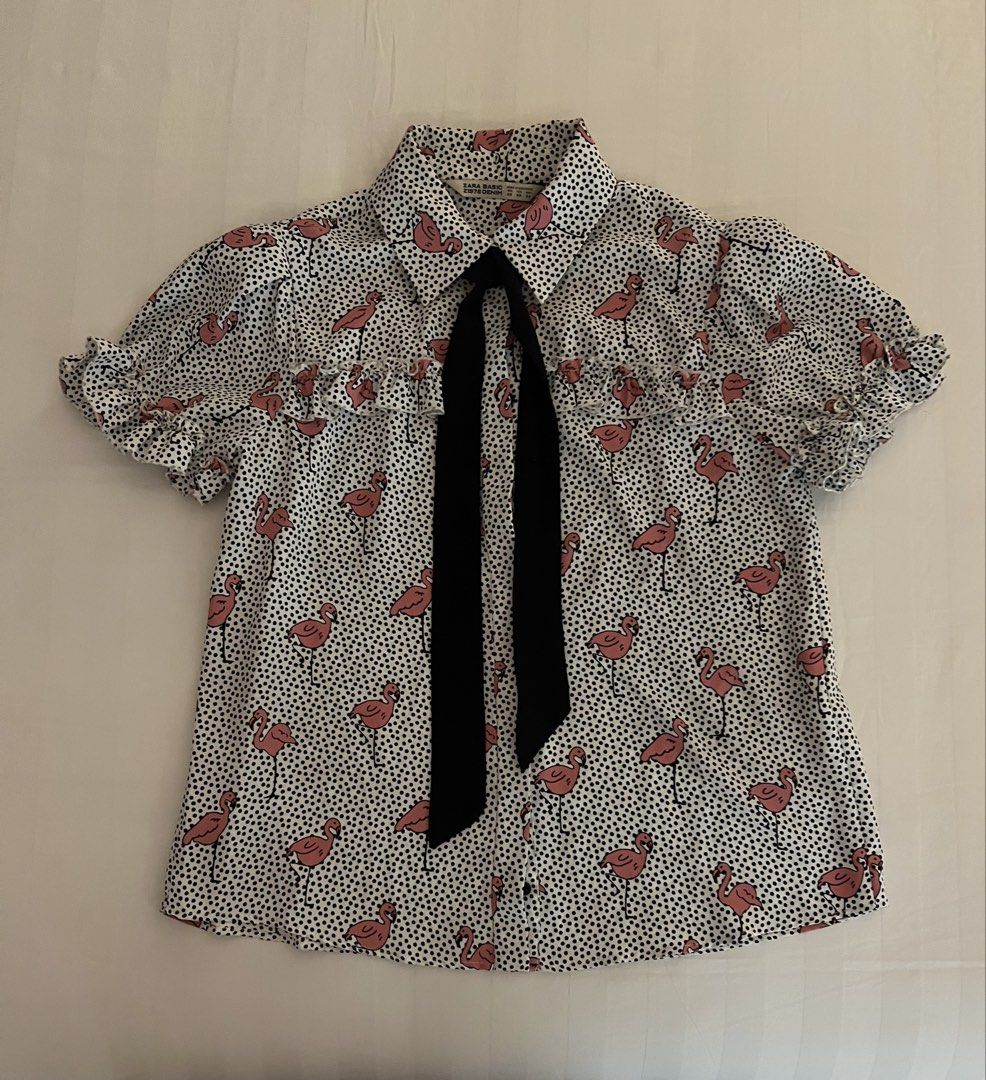 Zara Top (Category: Blouses) located in Quezon City. Submitted by inthefrow (Listing ID 1469820486, Image 1). Description: - Preloved - With the cutest flamingo 🦩 print - Accent: black tie - Fits a size small - For work or play • Best price already .