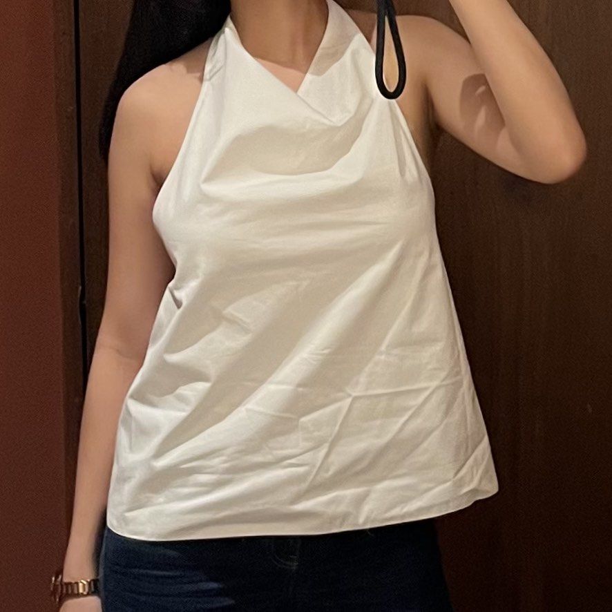 Zara White Halter Neck Top (Category: Sleeveless) located in Quezon City. Submitted by g.ysabel (Listing ID 1469889066, Image 1). Description: - Crisp white - Halter neck with an draped cowl neckline, adjustable straps - Condition: Brand new / Excellent quality.
