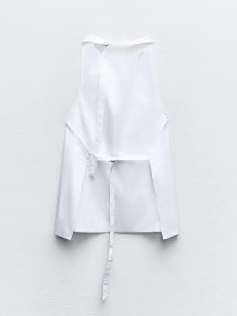 Zara White Halter Neck Top (Category: Sleeveless) located in Quezon City. Submitted by g.ysabel (Listing ID 1469889066, Image 3). Description: - Crisp white - Halter neck with an draped cowl neckline, adjustable straps - Condition: Brand new / Excellent quality.
