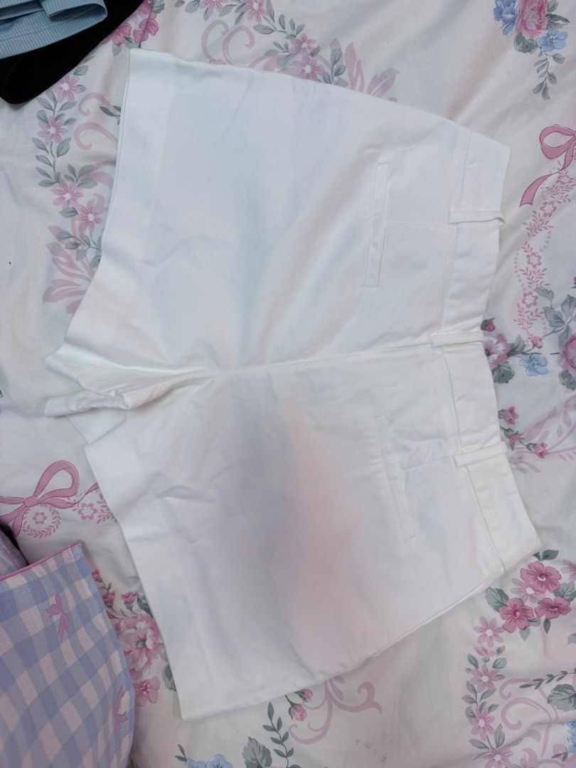 Zara White Tailored Shorts Size M (Category: Shorts) located in Manila. Submitted by ponyoandsosuke (Listing ID 1469945082, Image 3). Description: - Brand: Zara - Color: Solid White - Size: Medium (fits true to size) - Rise: Mid-rise with belt loops - Details: Front pleats and back pocket welt details - Condition: Brand new / Excellent - Styling: Clean, versatile look perfect for pairing with crop tops or blouses - Origin: Made in China Bought in
