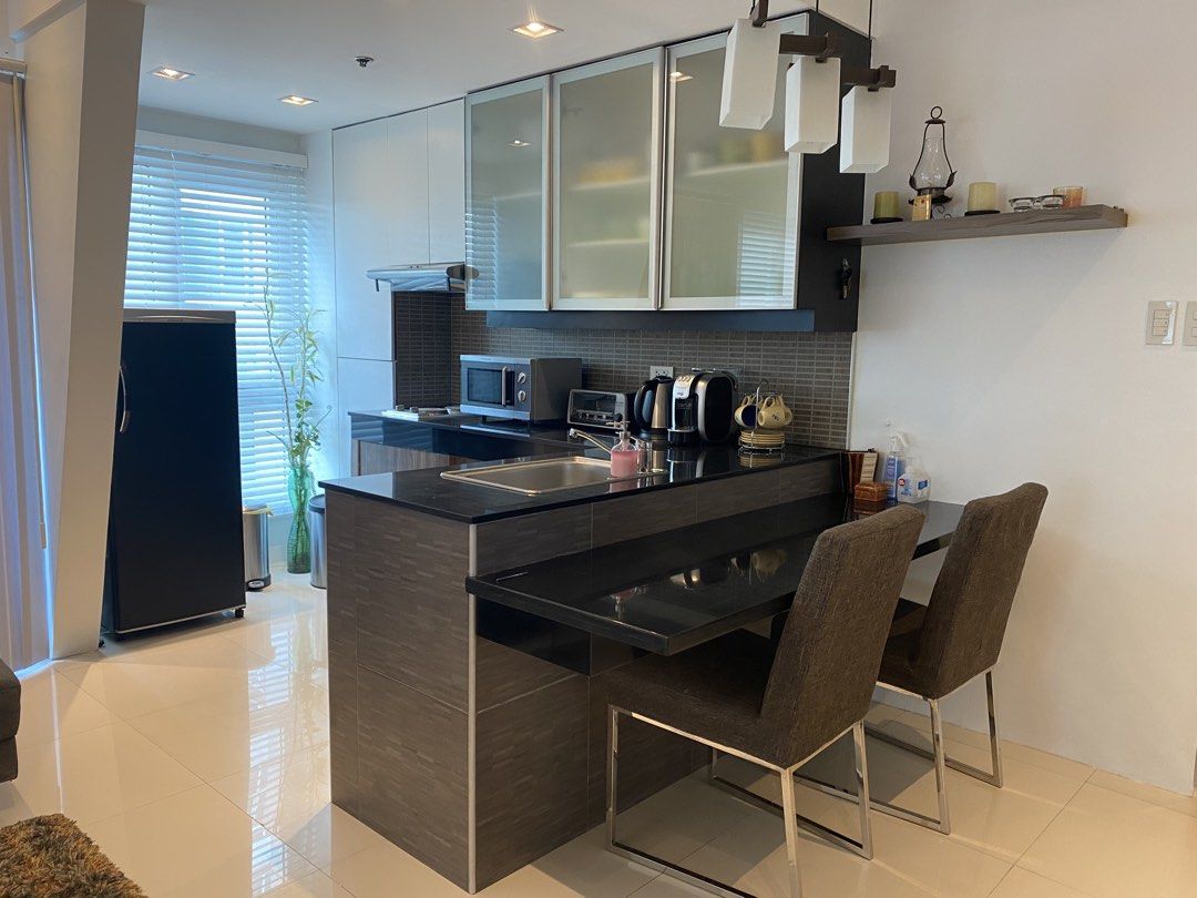 1BR Condo at BGC FOR SALE (Category: Apartments & Condos) located in Mandaluyong City. Submitted by happycrystal.c0df25 (Listing ID 1469984494, Image 1). Description: 1-BR BGC Condominium Unit for sale Corner unit, with Balcony, facing Blue Sapphire Cond. Address: Fort Palm Springs Cond., 30th st cor. 1st Ave, BGC 1BR, 1 T&B, Balcony, Living and Dining open area. Dining is counter-style. Fully furnished. Direct to owner. Direct buyers only.