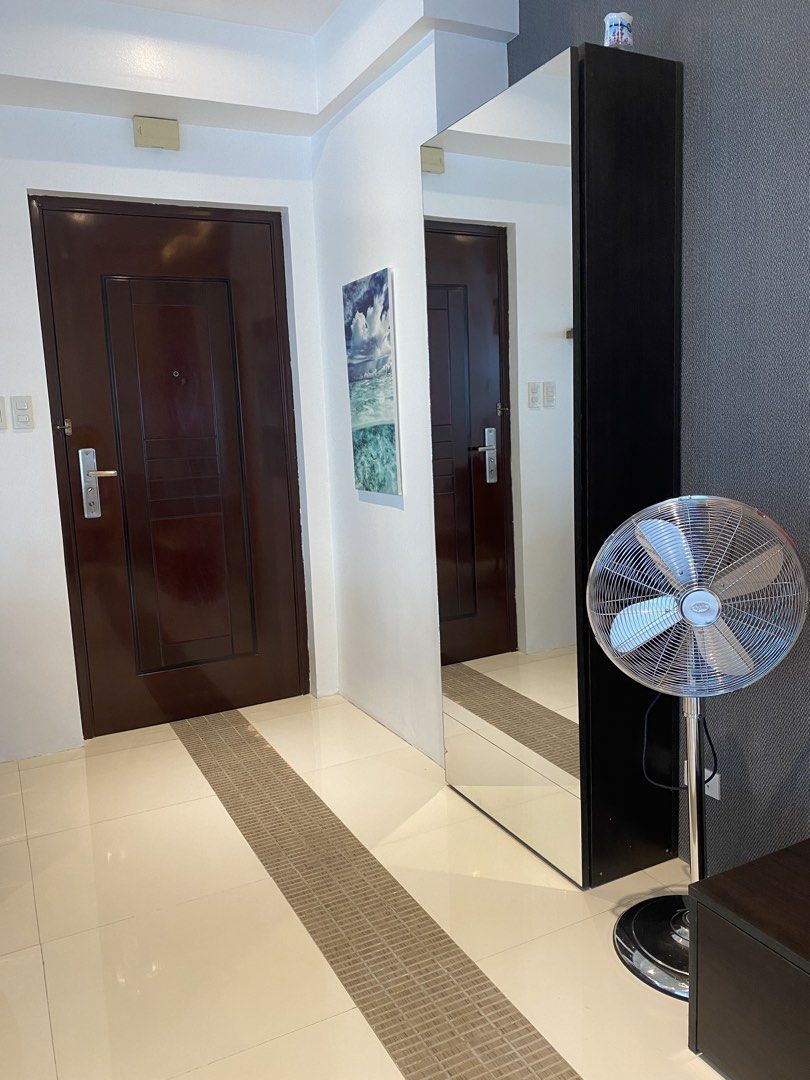 1BR Condo at BGC FOR SALE (Category: Apartments & Condos) located in Mandaluyong City. Submitted by happycrystal.c0df25 (Listing ID 1469984494, Image 2). Description: 1-BR BGC Condominium Unit for sale Corner unit, with Balcony, facing Blue Sapphire Cond. Address: Fort Palm Springs Cond., 30th st cor. 1st Ave, BGC 1BR, 1 T&B, Balcony, Living and Dining open area. Dining is counter-style. Fully furnished. Direct to owner. Direct buyers only.