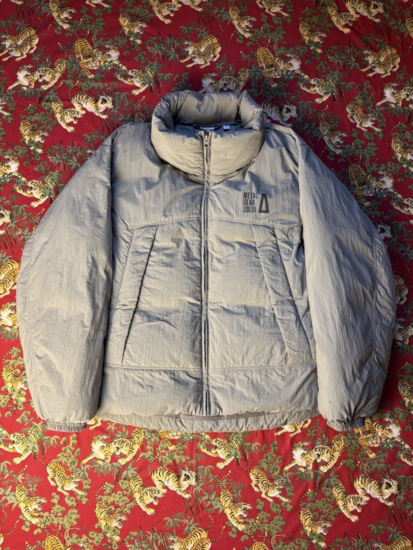 2024 GU x Metal Gear Solid Military Style Padded Stand Jacket - Grey (Category: Coats, Jackets and Outerwear) located in Caloocan City. Submitted by ruvendnewborn (Listing ID 1470063621, Image 2). Description: 2024 GU x Metal Gear Solid Military Style Padded Stand Jacket - Grey Flat Measurements: (IN INCHES) Width: 24” Length: 29.5” Shoulder: 21.5” Sleeve Length: 25” - Tagged as size Large - Fits Large to XL frame - Like new condition - Made of 1