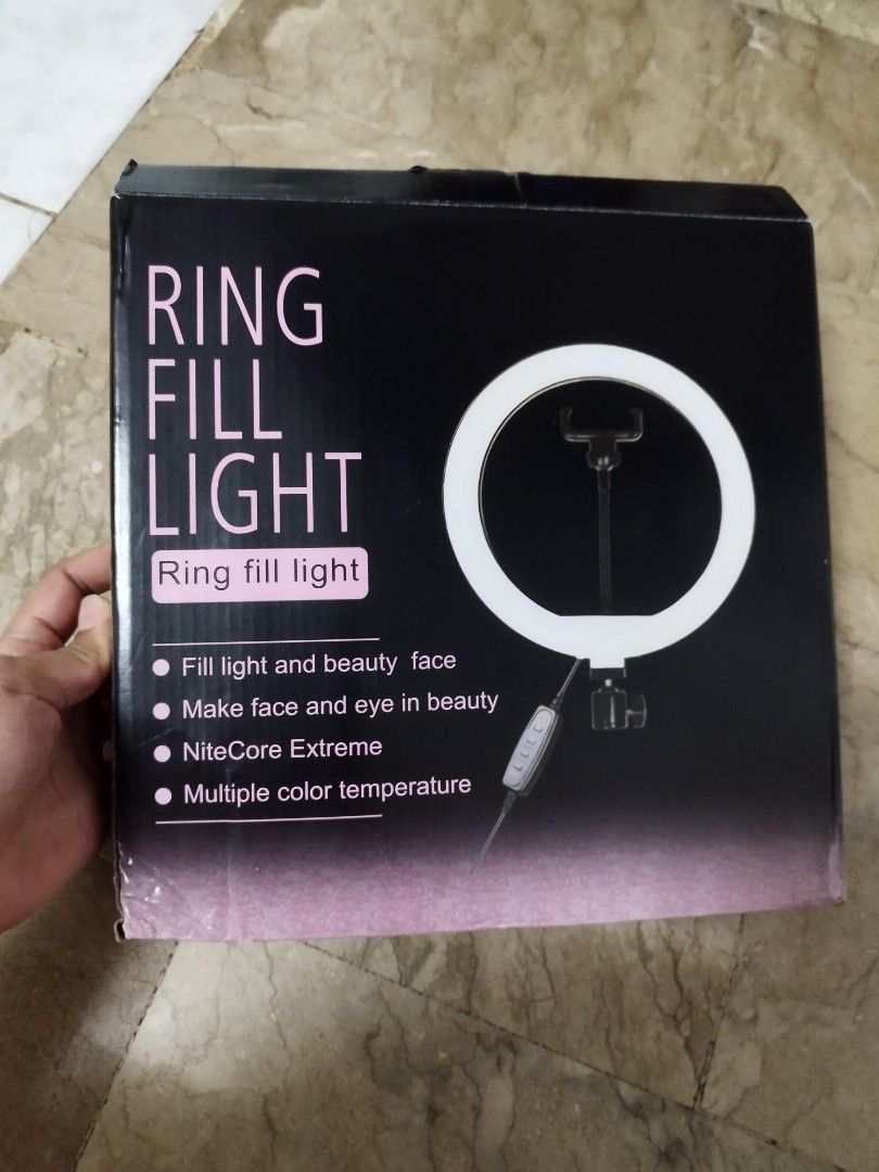 26cm LED Ring Fill Light Set with Adjustable Tripod Stand (Category: Lighting) located in Mandaluyong City. Submitted by mjing.1917 (Listing ID 1470029484, Image 1). Description: Condition: 10/10 (Brand New / Open Box Condition - complete and pristine) ✨ Complete Package Included: - 1x 26cm (10-inch) LED Ring Light with attached USB cable and remote controller - 1x Adjustable Tall Metal Tripod Stand (Still wrapped in original plastic!) - 1x Flexi