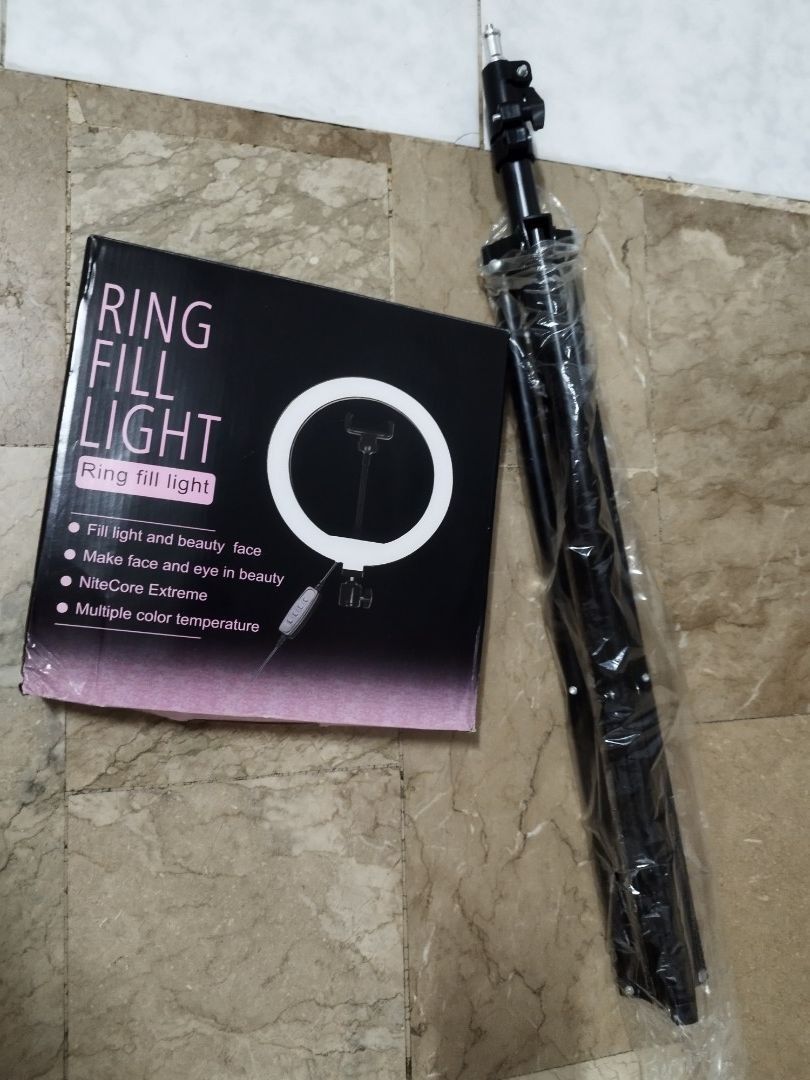 26cm LED Ring Fill Light Set with Adjustable Tripod Stand (Category: Lighting) located in Mandaluyong City. Submitted by mjing.1917 (Listing ID 1470029484, Image 3). Description: Condition: 10/10 (Brand New / Open Box Condition - complete and pristine) ✨ Complete Package Included: - 1x 26cm (10-inch) LED Ring Light with attached USB cable and remote controller - 1x Adjustable Tall Metal Tripod Stand (Still wrapped in original plastic!) - 1x Flexi
