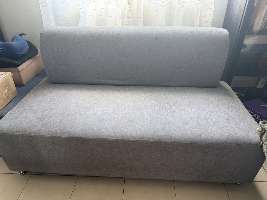 2 seater sofa (Category: Sofas) located in Pasig City. Submitted by francisco201 (Listing ID 1470000341, Image 2). Description: Bought from All Home Foam is still firm but fabric cover need cleaning No tears just stains that can be removed by surface cleaning. Gray color Fabric cover.