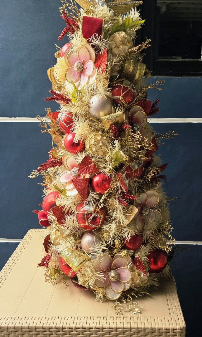3 Ft. Fully Decorated Customized Christmas Tree without lights (Category: Other Home Decor) located in Caloocan City. Submitted by seokjinie27 (Listing ID 1470138806, Image 3). Description: Selling our beautiful, fully decorated 3ft Customized Christmas Tree! Built with a luxurious red and pink champagne with touch of gold color scheme that’s perfect for table/desk display or cozy spaces. ​Original Purchase Price: ₱4,500 without the lights, I add