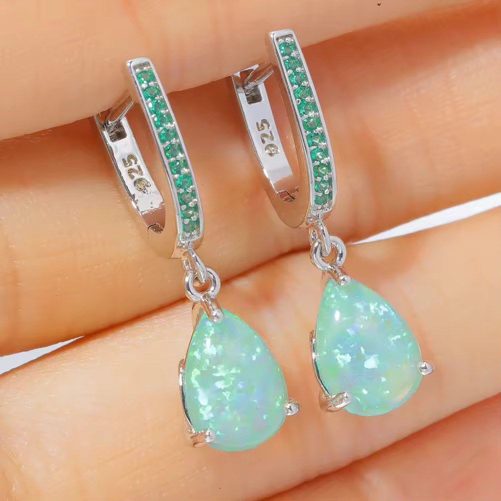 925 Silver Green Created Opal & Quartz Dangle Earrings (Category: Earrings) located in Manila. Submitted by hackelina (Listing ID 1470075616, Image 3). Description: - Material: Genuine Sterling Silver 925 - Main Stone: 10 x 8 mm pear-shaped created opal with vibrant green play-of-color - Accents: Sparkling 1 mm green quartz stones on the hoop - Dimensions: Total length of 27 mm - Weight: Lightweight at 2.52 grams - Closure: Secure leverback for a