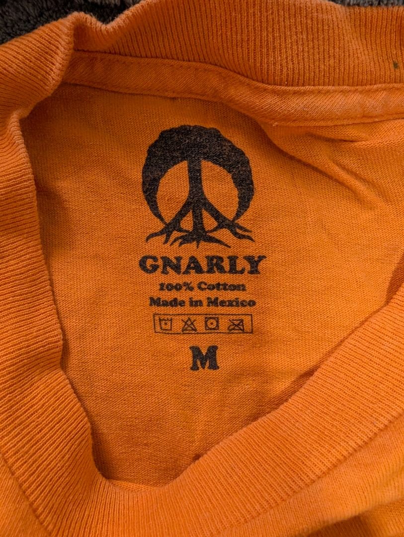 👕 Gnarly | Orange Long Sleeve Shirt (Category: Longsleeves) located in Agdangan. Submitted by ej-declutter (Listing ID 1470017612, Image 3). Description: 📏 Size: Medium ↔️ Width: 18" 📐 Length: 27.5" ✨ Condition: Excellent Condition ⚠️ Issues/Defects: Minor stains .