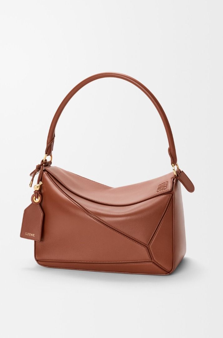 💜 LOEWE Medium Leather Featherlight Puzzle Top-Handle Bag (Category: Luxury Bags & Wallets) located in Lala. Submitted by mohsin0825 (Listing ID 1470034250, Image 3). Description: LOEWE Medium Leather Featherlight Puzzle Top-Handle Bag 17,990p pl7s sf Like new/ Brandnew shoulder or crossbody carry detachable and adjustable strap with rotating dogclips zip closure with articulated pull detachable LOEWE embossed tag with secret pocket and balloon 