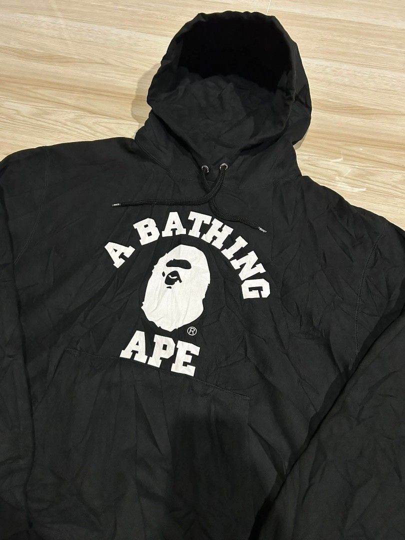A Bathing Ape BAPE Black Arch Logo Hoodie (Category: Hoodies) located in Manila. Submitted by thegoodstuffs__ (Listing ID 1470139780, Image 2). Description: - Authentic Black BAPE Hoodie - Features iconic large white arch logo and ape head graphic on the front - Premium heavyweight cotton fleece for maximum comfort and warmth - Branded metal drawstrings tips and engraved eyelets - Classic sleeve tag near the cuff - Practical kangaroo pocket with 