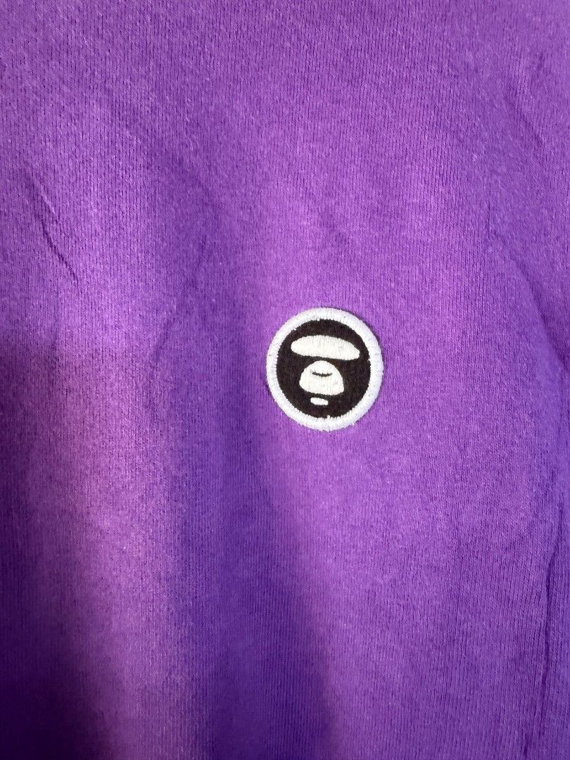 Aape Avenow Purple Long Sleeve Tee (Category: Tshirts & Polo Shirts ) located in Quezon City. Submitted by lexthrift (Listing ID 1469988428, Image 2). Description: - Brand: Aape by A Bathing Ape - Style: Purple long sleeve crewneck t-shirt - Size: Large (tag attached) - Details: Avenow text printed down both sleeves - Branding: Small Ape head logo patch on left chest and matching cuff tag - Condition: 100% authentic, well-maintained - Mode of Pay