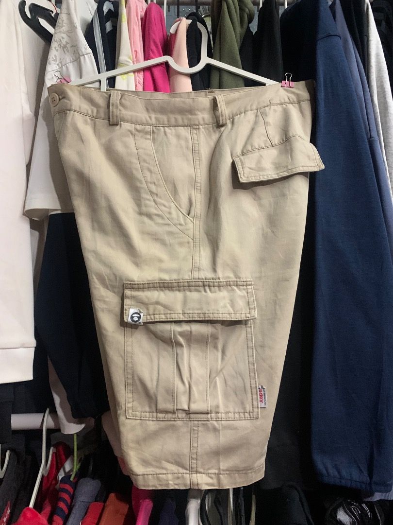 Aape By A Bathing Ape Beige Cargo Shorts (Category: Shorts) located in Gingoog City. Submitted by relux (Listing ID 1469988673, Image 2). Description: Authentic Aape By A Bathing Ape beige cargo shorts in a relaxed fit. Features multiple utility pockets and signature camo patches. Sturdy cotton fabric, great for daily streetwear. Inner labels intact..