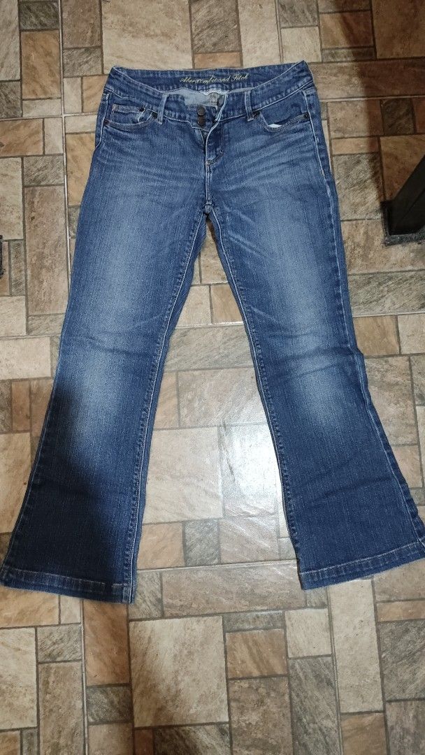 Abercrombie & Fitch Stretch Jeans Size 4 (Category: Jeans) located in Mangatarem. Submitted by itsumo_kokoro (Listing ID 1469979703, Image 1). Description: - Brand: Abercrombie & Fitch - Style: Stretch denim jeans in dark blue wash with slight thigh fading - Size: 4 - Closure: Two-button closure with zip fly - Pockets: Distinctive flapped back pockets with button closures and contrast stitching - Material: 98% cotton, 2% elastane for a comfortabl