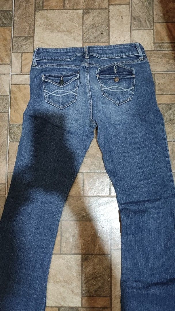 Abercrombie & Fitch Stretch Jeans Size 4 (Category: Jeans) located in Mangatarem. Submitted by itsumo_kokoro (Listing ID 1469979703, Image 2). Description: - Brand: Abercrombie & Fitch - Style: Stretch denim jeans in dark blue wash with slight thigh fading - Size: 4 - Closure: Two-button closure with zip fly - Pockets: Distinctive flapped back pockets with button closures and contrast stitching - Material: 98% cotton, 2% elastane for a comfortabl