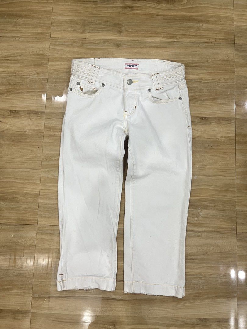 Abercrombie & Fitch Capri (Category: Jeans) located in Angeles City. Submitted by thriftsij (Listing ID 1470056393, Image 1). Description: - Brand: Abercrombie & Fitch - Size: 00 28W 27L T9 7O - Material: 100% Cotton - Color: Clean White - Capri pants - Details: Contrast yellow stitching, unique braided waistband, and embroidered moose logo on the coin pocket .