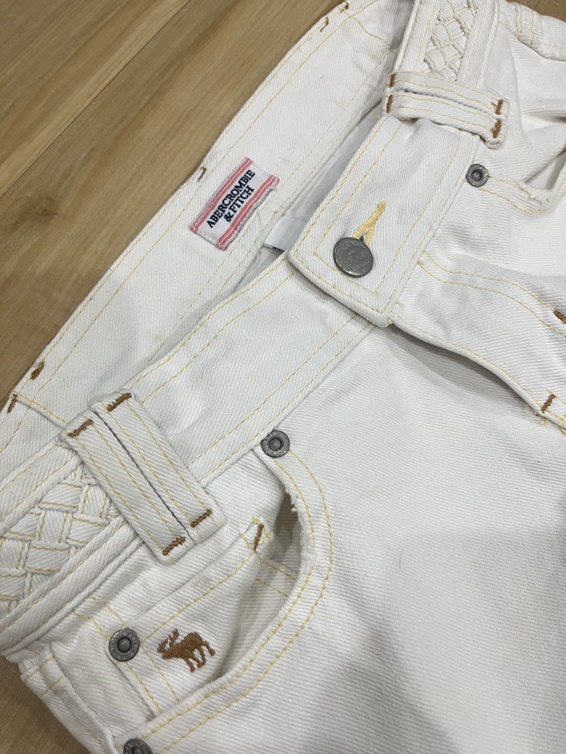 Abercrombie & Fitch Capri (Category: Jeans) located in Angeles City. Submitted by thriftsij (Listing ID 1470056393, Image 2). Description: - Brand: Abercrombie & Fitch - Size: 00 28W 27L T9 7O - Material: 100% Cotton - Color: Clean White - Capri pants - Details: Contrast yellow stitching, unique braided waistband, and embroidered moose logo on the coin pocket .