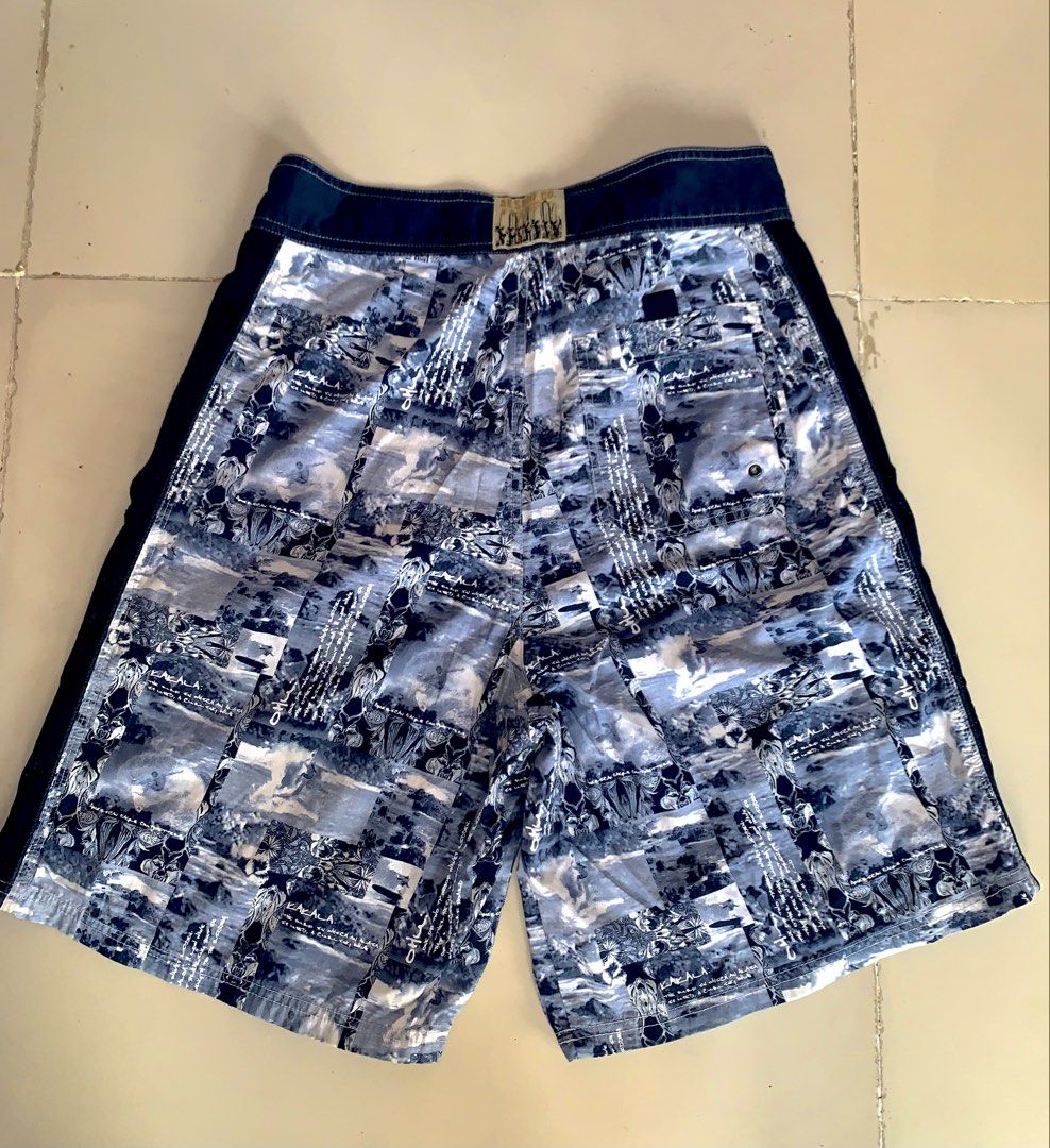 ABS Surf Co Board Shorts Blue White Graphic Print (Category: Swim Trunks & Board Shorts) located in Bacolod City. Submitted by jonathancanon_1o1 (Listing ID 1469965405, Image 2). Description: Dimes: W-32/33 L-21/22 Issue : Slight stain in knee area and distress in pocket hole..