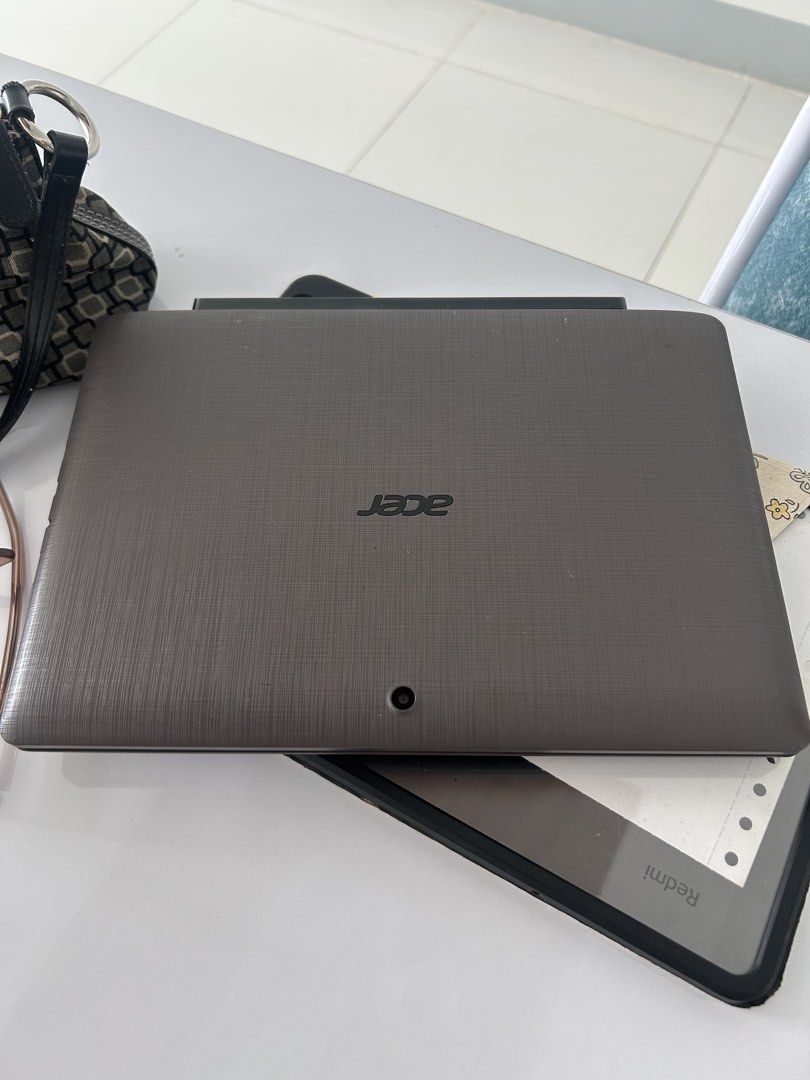 Acer Aspire Switch 2-in-1 Laptop Tablet (Category: Laptops & Notebooks) located in Tuguegarao City. Submitted by eliwyxzs (Listing ID 1470141625, Image 1). Description: -issue: nag rerestart siya and laggy - Acer Aspire Switch 2-in-1 convertible laptop and tablet - Stylish dark grey textured finish - Detachable keyboard dock with built-in USB port, standard layout, and trackpad - Powered by an efficient Intel processor - Compact and handy for typ