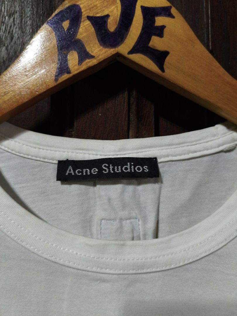 Acne Studios Patch Design White T-shirt Small (Category: Tshirts & Polo Shirts ) located in Bayambang. Submitted by rajuergui76226 (Listing ID 1470008388, Image 2). Description: - Brand: Acne Studios - Color: Solid White (10/10 condition) - Size: Small (18.5" width x 25" length) - Material: 100% Cotton, Made in Portugal - Design: Classic crewneck with unique embroidered animal patches - Flaws: Has a repaired pinhole on the back, otherwise in very