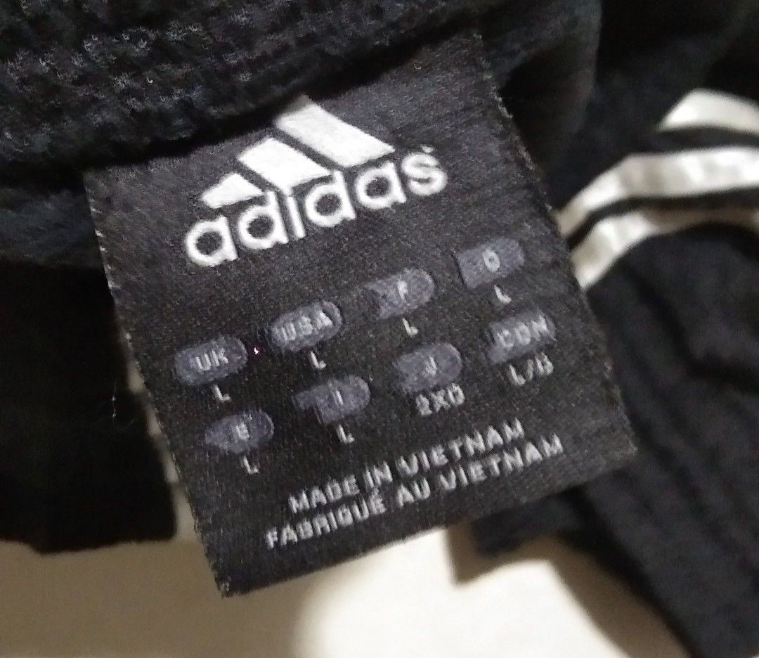 Adidas Black Athletic Shorts with Three Stripes Size L (Category: Activewear) located in Manila. Submitted by aj.bermundo (Listing ID 1470025199, Image 2). Description: - Brand: Adidas - Color: Classic Black with White Stripes - Size: Large (tag attached) - Design: White piping on hem with Adidas logo hit - Fit: Easy pull-on elastic waistband - Origin: Made in Vietnam - Condition: Brand new with tags.