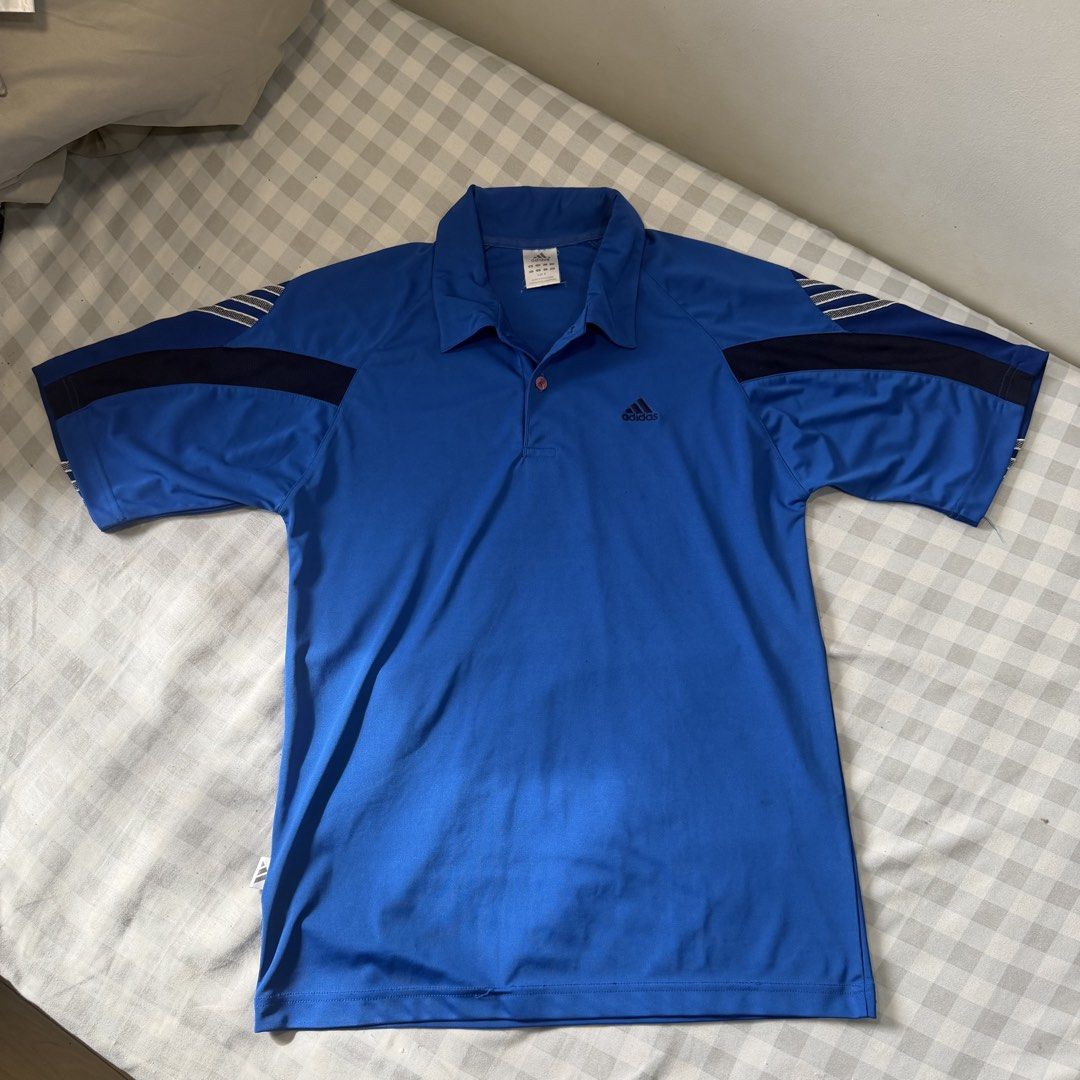 Adidas Blue Polo Shirt Size M (Category: Tshirts & Polo Shirts ) located in Manila. Submitted by jxuerae (Listing ID 1470125506, Image 1). Description: - Brand: Adidas - Color: Bright blue with dark accents on sleeves and collar - Size: Medium (Regular fit) - Details: Three-button placket with one branded button, embroidered Adidas logo on chest - Origin: Made in Singapore - Condition: Excellent Color may vary due to lighting. Dm me for dimes Pre