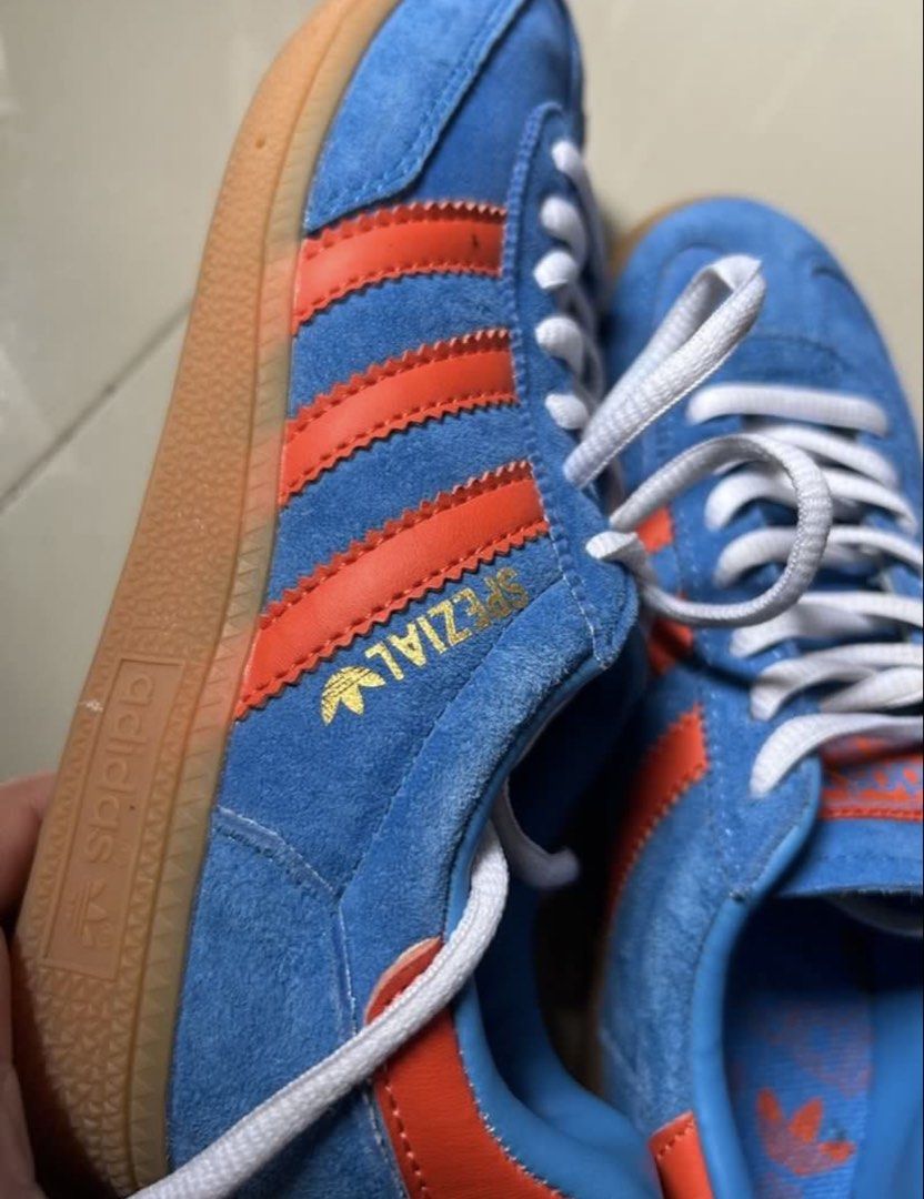 Adidas Handball Spezial Blue Orange (Category: Sneakers) located in Quezon City. Submitted by jamsweetjam (Listing ID 1470039220, Image 3). Description: - Style: Retro indoor trainer - Colorway: Bright blue suede with vibrant orange stripes - Soles: Classic gum soles with clean textured treads - Details: Metallic gold branding on the side, neat white laces - Comfort: Comfortable fit, ideal for daily casual wear.
