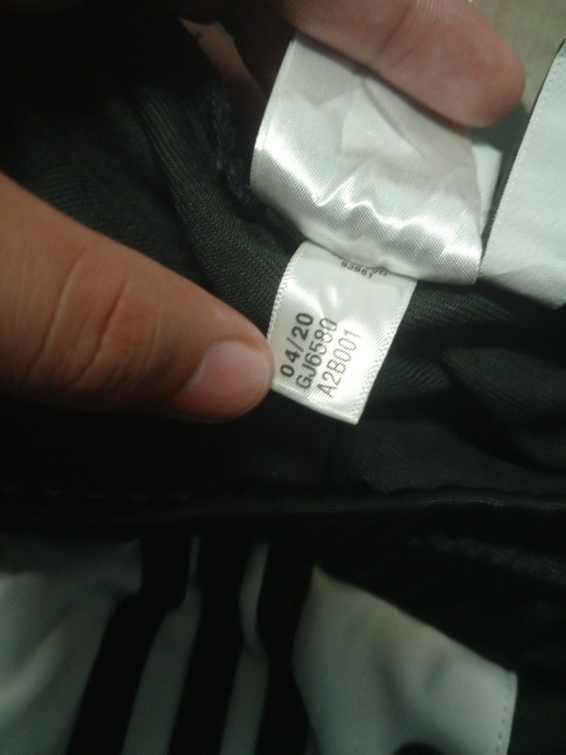 Adidas Snap Track Pants Black White Size L (Category: Joggers) located in Manila. Submitted by heavenlyclo05 (Listing ID 1470001258, Image 3). Description: ADIDAS BAGGY TRACKPANT Size: Large Width: 34 - 40 Length: 39 Hem: 10 Very Good Condition issue: ALTERED - Brand: Adidas - Color: Black and White - Style: Wide leg with full snap buttons down the sides - Details: Large Adidas logo badge on the left leg - Waistband: Drawstring elastic waist for 