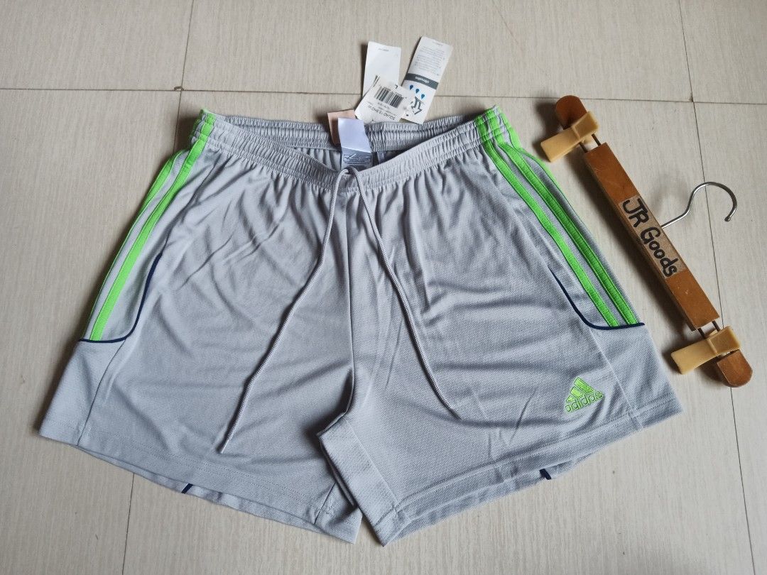 Adidas Squad 13 Grey Green Size L (Category: Shorts) located in Tanay. Submitted by jrgoods (Listing ID 1469985996, Image 3). Description: ADIDAS climalite Large men's above the knee Waistline 32-36 Length 15 Brand-new w/ tags 550+ship Tanay Rizal location Shipping Nationwide - Color: Light grey with ray green stripes and dark blue piping - Material/Tech: Climalite fabric for sweat-wicking comfort - Fit: Elastic waistband with adjustable drawstri
