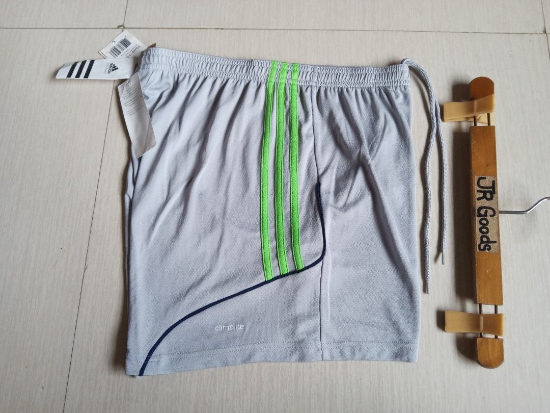 Adidas Squad 13 Grey Green Size L (Category: Shorts) located in Tanay. Submitted by jrgoods (Listing ID 1469985996, Image 2). Description: ADIDAS climalite Large men's above the knee Waistline 32-36 Length 15 Brand-new w/ tags 550+ship Tanay Rizal location Shipping Nationwide - Color: Light grey with ray green stripes and dark blue piping - Material/Tech: Climalite fabric for sweat-wicking comfort - Fit: Elastic waistband with adjustable drawstri