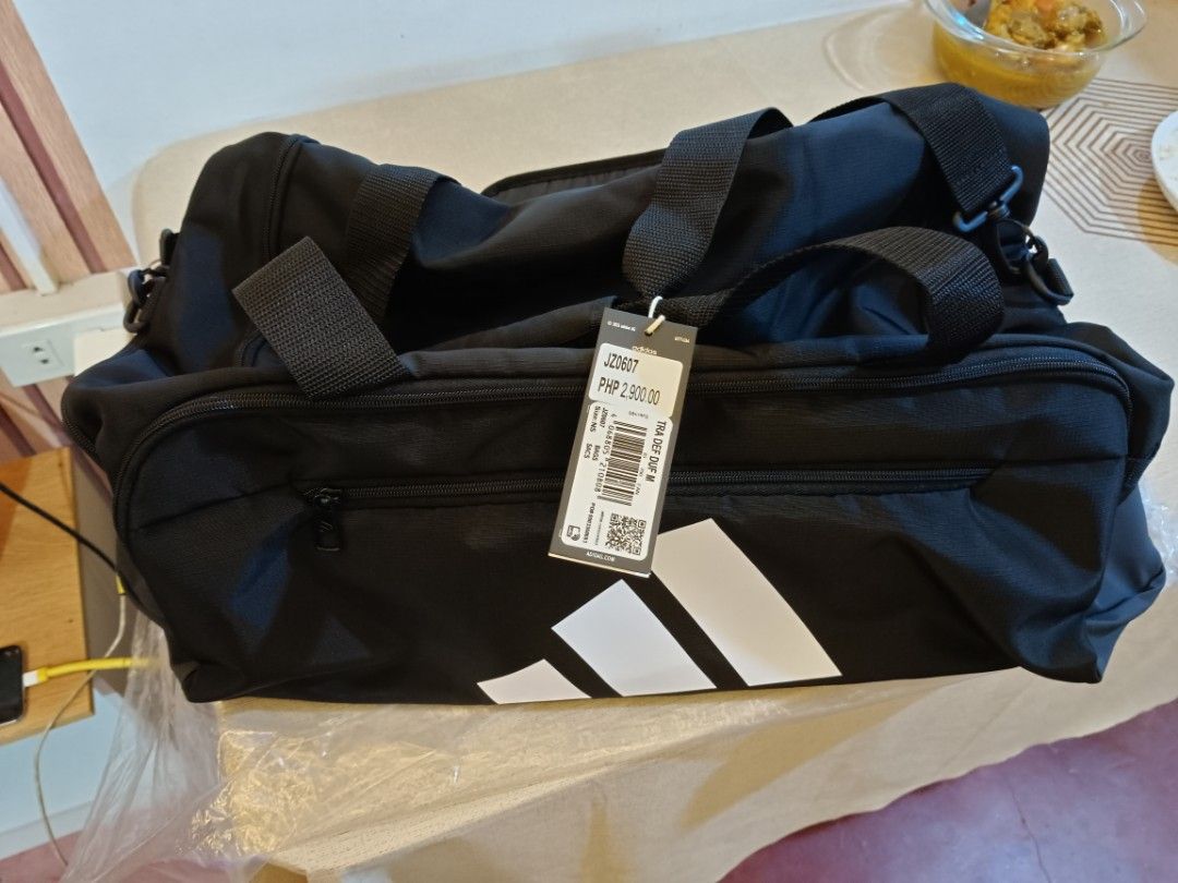 Adidas Training Defiant Duffel Bag Medium Black (Category: Sling Bags) located in Manila. Submitted by jhurramire25082 (Listing ID 1469997885, Image 3). Description: 100% orig. duffle bag adidas brandnew ,kakabili lng. rfs: mali ng nabili srp: 2,900 Now: 2k nlng pra sa mahihilig gumala pdeng pde sayo to - Brand: Adidas - Color: Black with big white logo - Size: Medium - Condition: Brand new with original tag (PHP 2,900 retail price) and packaging
