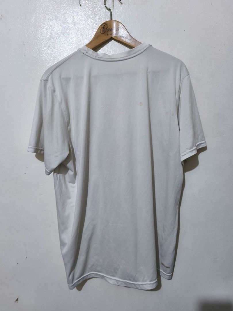 Adidas White Polyester T-Shirt (Category: Shirts) located in Caloocan City. Submitted by Tulokss (Listing ID 1470114457, Image 2). Description: - Brand: Adidas - Material: 100% polyester (lightweight and breathable) - Color: White - Details: Short sleeves, crew neck, small printed logo on the chest - Origin: Made in Nicaragua - Condition: Good for casual wear or workouts, but please note there are noticeable stains near the chest area and on the 