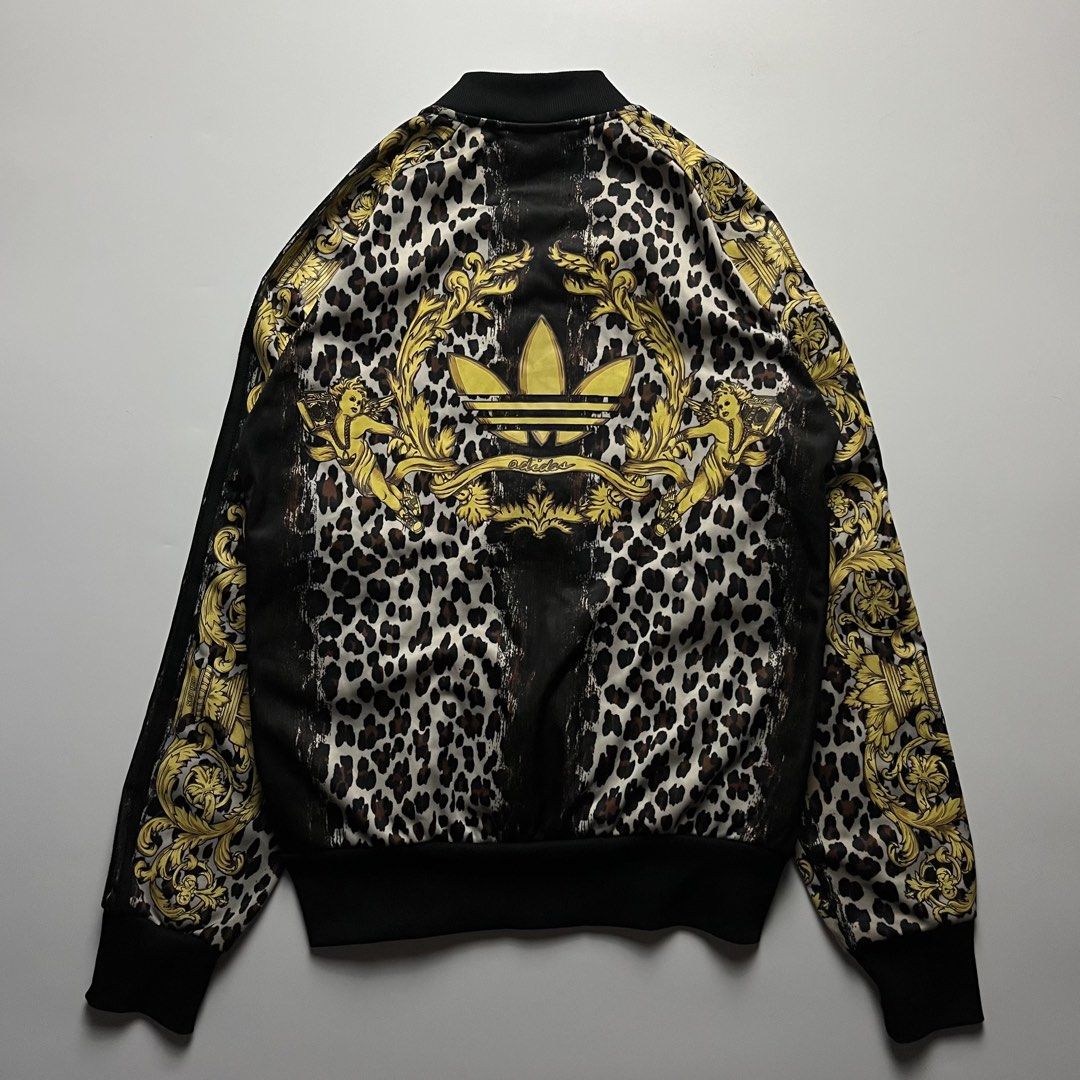 Adidas x Jeremy Scott Leopard Cherub Track Jacket (Category: Coats, Jackets and Outerwear) located in Manila. Submitted by streetsavvy (Listing ID 1470050381, Image 2). Description: Adidas x Jeremy Scott Leopard Cherub Track Jacket Size: Medium Width: 18” Length: 24” Hem: 15” Measured in Inches Condition: Excellent condition Made in China.