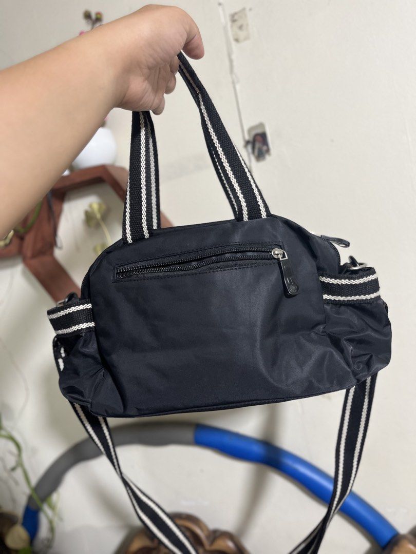 AGNÈS B. Two-Way Multi Pocket Style Bag (Category: Cross-body Bags) located in Manila. Submitted by dayclutter (Listing ID 1470095125, Image 2). Description: Used but not abused With Adjustable Strap Approx 10x7x4 inches **need labhan ulit dahil matagal di nagamit.