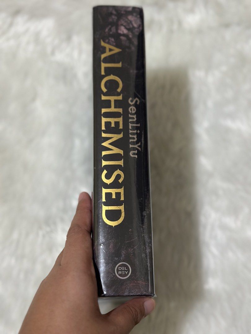 Alchemised Hardcover (Category: Storybooks) located in Paranaque City. Submitted by aurorakook (Listing ID 1470091927, Image 2). Description: - Title: Alchemised by SenLinYu - Publisher: Del Rey - Format: Hardcover with exclusive black and gold foil cover design - Condition: Brand new, sealed in original plastic wrapping, unread - Price Tag: Fully Booked price tag of ₱1848.00 intact - ISBN: 978-0-593-97270-0 CAN DO MEETUPS NEAR PARANAQUE/PASAY RF