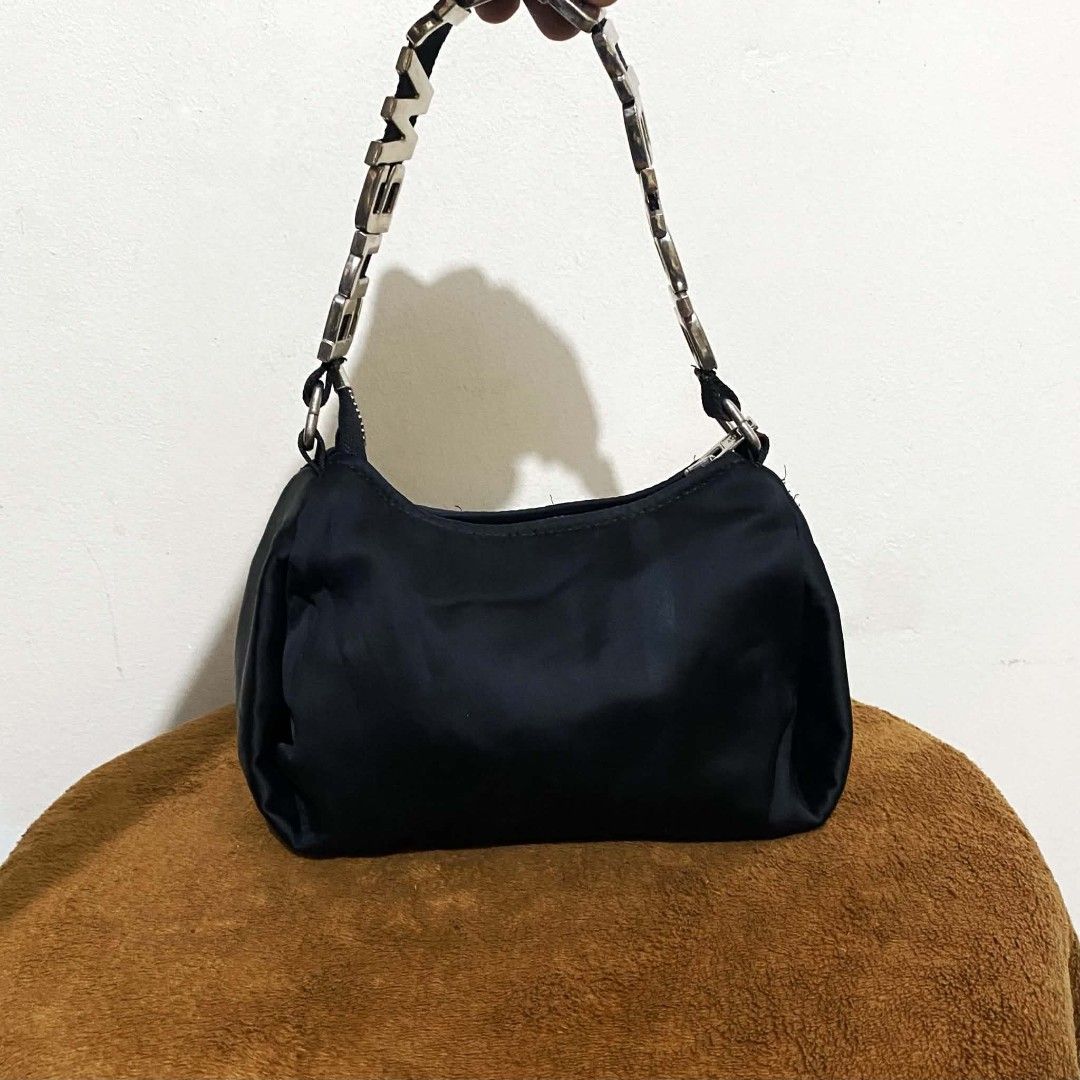 Alexander Wang Black Nylon Heiress Shoulder Bag (Category: Luxury Bags & Wallets) located in Manila. Submitted by jiiiiiiiiiims (Listing ID 1470071799, Image 2). Description: - Brand: Alexander Wang New York - Material: Durable black nylon with European leather details - Hardware: Silver-tone throughout with branded zippers - Standout Feature: Chunky metal letters strap spelling out the brand name - Interior: Clean lining with leather brand patch